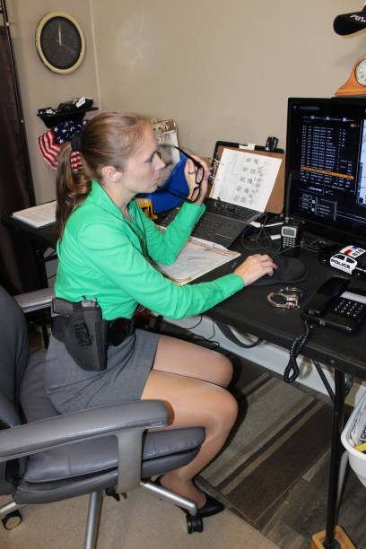 istock Female detective working in office 1433749992