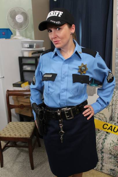 istock Female police officer, blue uniform 1433750361