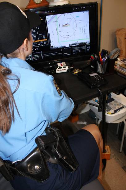 istock Female police officer, blue uniform 1433750439