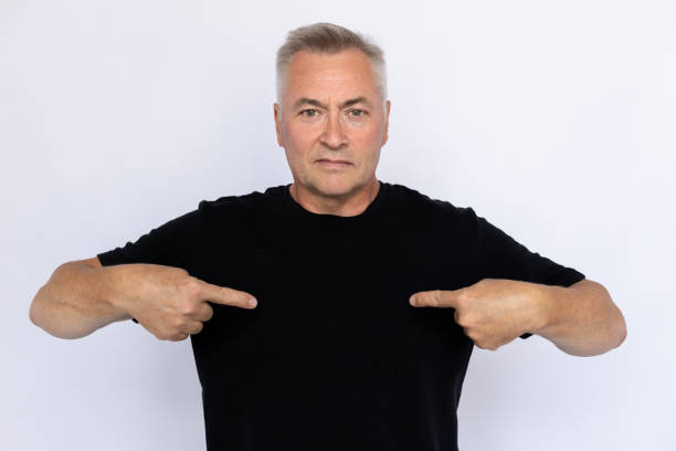 istock Portrait of serious elderly man pointing at himself 1433750514