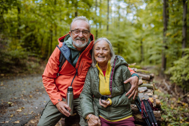 istock Senior couple having break during hiking in autumn forest. 1433751276
