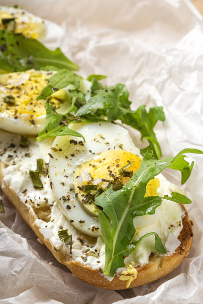 istock Toast with cream cheese, arugula salad and boiled egg 1433753036
