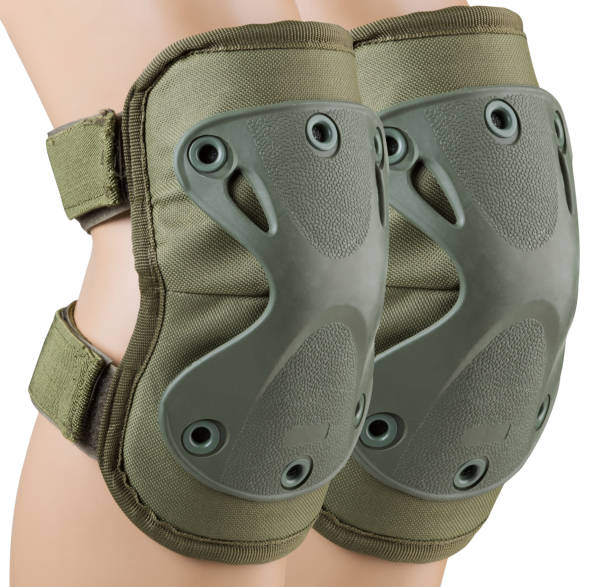 istock Army tactical knee pads on the legs, khaki color, close-up, on a white background, isolate 1433753995