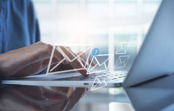 istock Email marketing concept, person reading e-mail on laptop computer, receive new message with electronic mail icons on virtual screen 1433755926