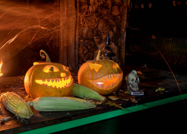 istock halloween composition with smiling pumpkins and halloween accessories, corn cobs, skull and lanterns, carved pumpkin 1433756747