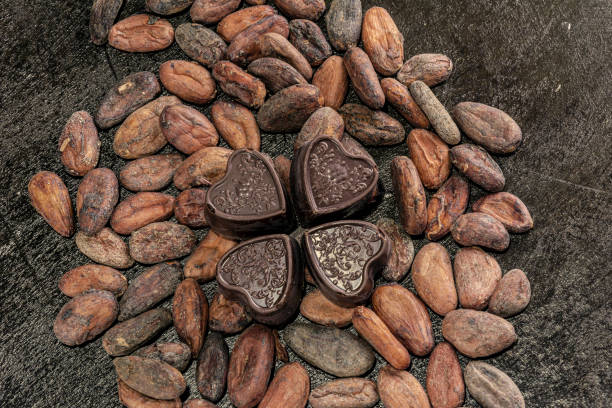 istock Chocolate hearts over cocoa beans. 1433764088