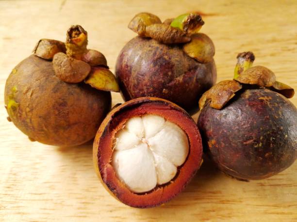 istock some mangosteen fruit on a wooden table 1433770064