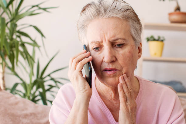 istock Unhappy stressed mature middle aged woman looking at phone screen 1433770071
