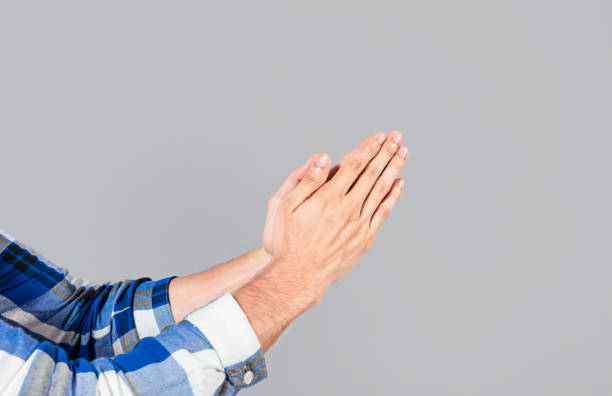 istock Two hands together in prayer position. Two hands together in prayer on isolated background. Concept of prayer and hands together. Two hands together thanking or asking for forgiveness 1433770094