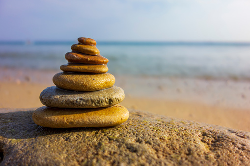 Stack of balanced stones on the beach
