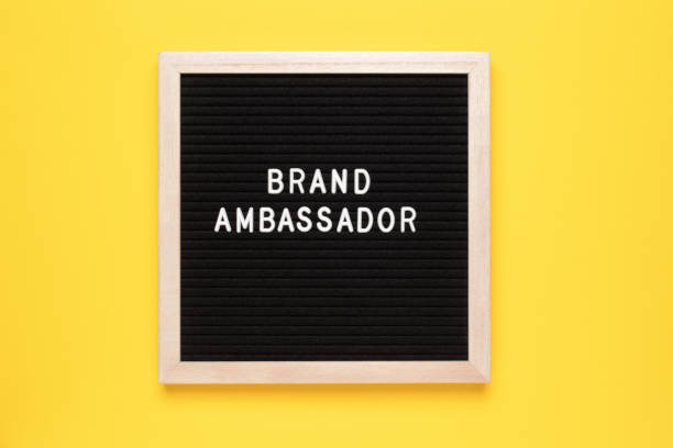 istock Brand Ambassador Text on letter board on yellow background 1433773431