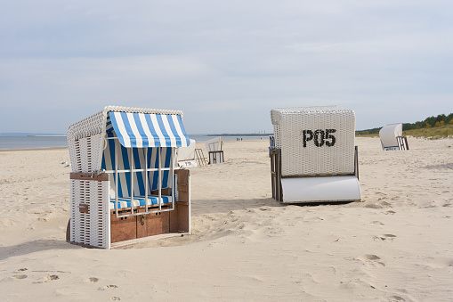 Beach chairs on the beach of the Baltic Sea near Ahlbeck in Germany at the end of the vacation season in autumn