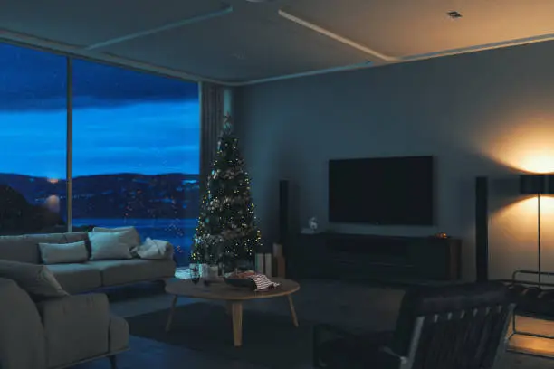 Interior of a contemporary minimalist living room with home entertainment system on Christmas night.