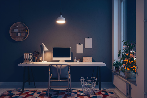Scandinavian style working space at night.