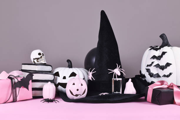 istock Pink and white Halloween decor on gray background 1433779381