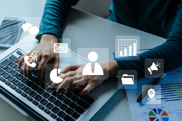 istock Business Strategy. people hand using laptop computer and mobile smart phone with virtual graphic icon diagram on desk, digital marketing, business finance, internet network technology concept 1433779433