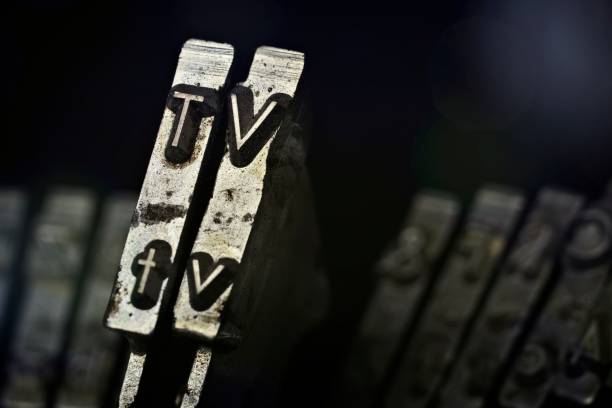 istock Close-up from an old typewriter with the leters TV - Horizontal picture with copy space. 1433782522
