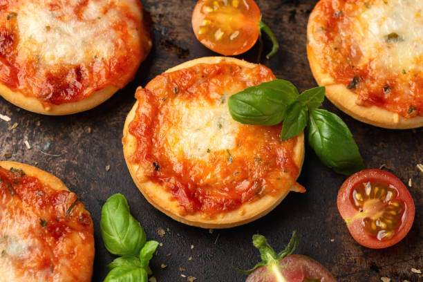 istock Mini pizzas with tomatoes and mozzarella cheese 1433784158