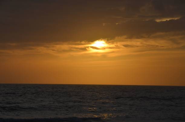 istock Beautiful golden sunset reflected in the sea waves 1433784718