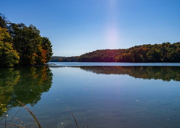 istock Blue lake with autumn trees in the background reflected on the water 1433785347