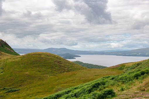 Part of a long distance walk, the West Highland Way passes this viewpoint of Loch Lomond from the summit of Conic Hill in Balmaha, Scotland, UK.