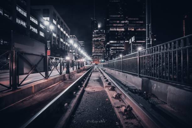 istock Railway between railings in an illuminated city 1433789165
