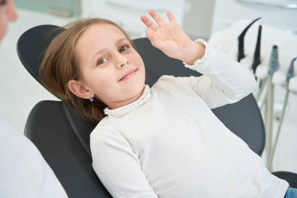 istock Smiling little patient approving her pediatric dentist 1433792597