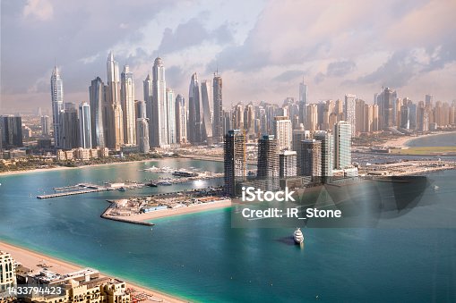 istock Dubai, UAE United Arabs Emirates. City of skyscrapers, Dubai marina in the sunny day with front line of   beach hotels and blue water of Persian gulf 1433794423