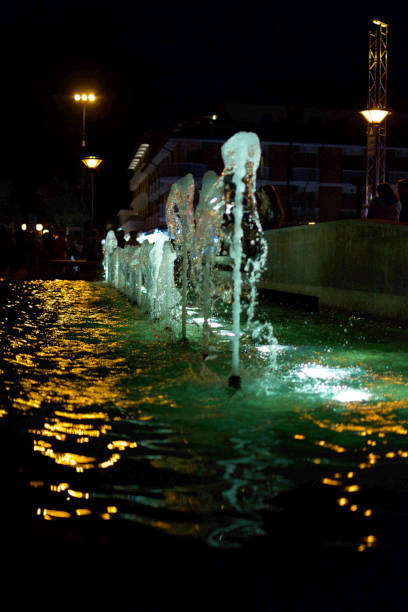 istock fountain with water jets illuminated during the night. 1433794731