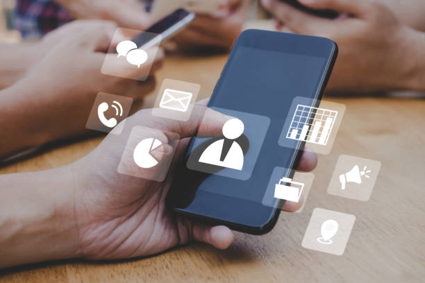 istock people hand using mobile smart phone with virtual social media icon diagram, mobile application, contact us, digital marketing, work from home, business finance, internet network technology concept 1433794962
