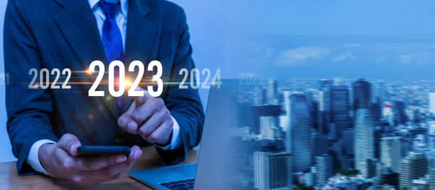 istock 2023. smart businessman investor using mobile phone with virtual screen on city background, business trend, change from 2022 to 2023, strategy, investment, business planning and happy new year concept 1433794981