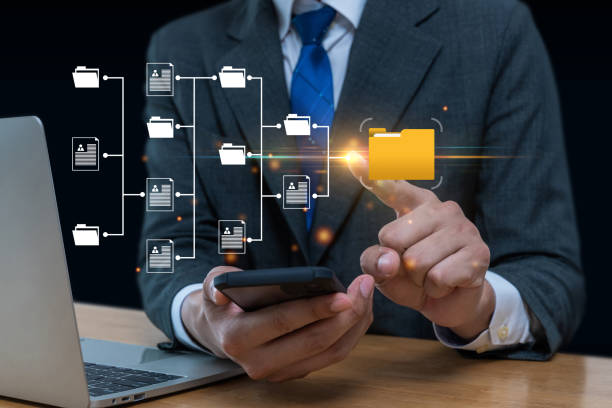istock Document Management System. business man hand touching virtual graphic icon diagram with mobile smart phone, cyber internet security, internet network security, digital and business technology concept 1433796496