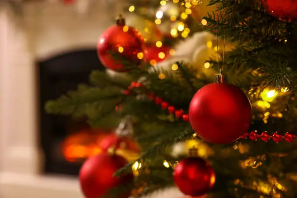 Christmas tree with beautiful decor indoors, closeup. Space for text