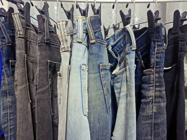 istock Many old jeans hanging on a clothes rail. 1433806924