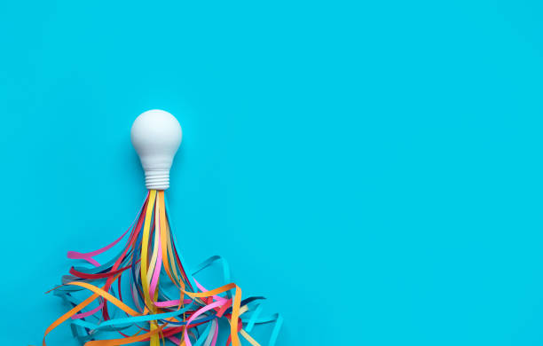 Ideas,inspiration concepts with rocket light bulb and colorful sparks on blue background stock photo