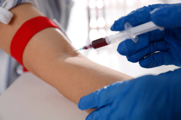 istock Nurse drawing blood sample from patient in clinic, closeup 1433809403