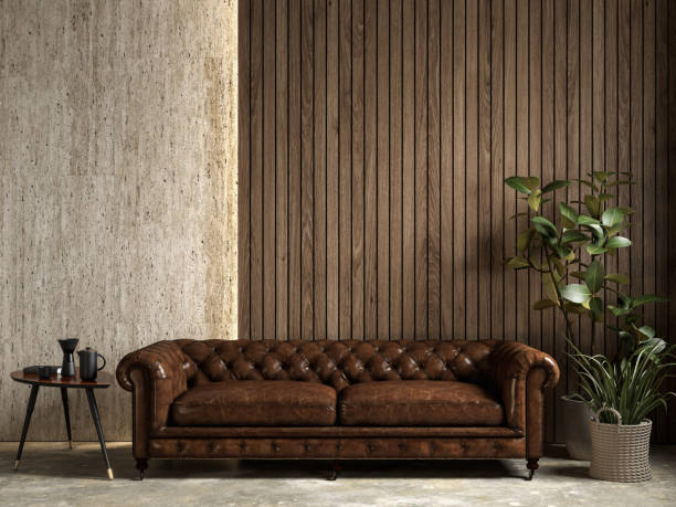 istock Interior with brown leather chester sofa, stone wood wall panel, backlight, plants and decor. 3d render illustration mockup. 1433809504