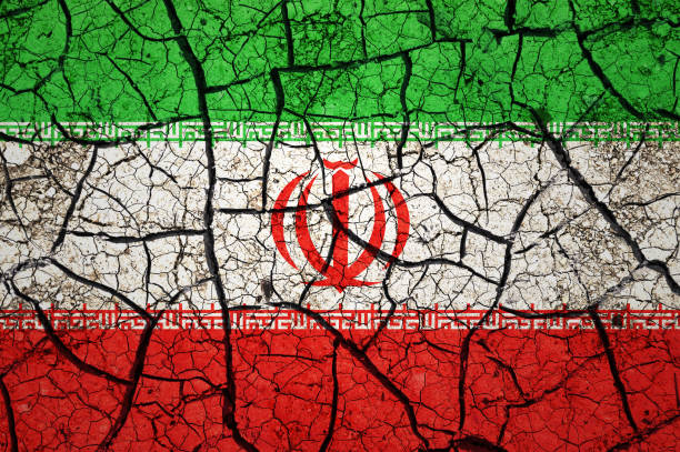 istock Dry soil pattern on the flag of Iran. 1433810434