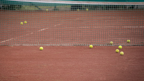 Tennis balls on the clay court