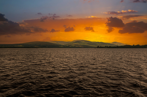 Digitally enhanced sunset scene of Loch Lomond from the beach at Cashel, Scotland, UK.