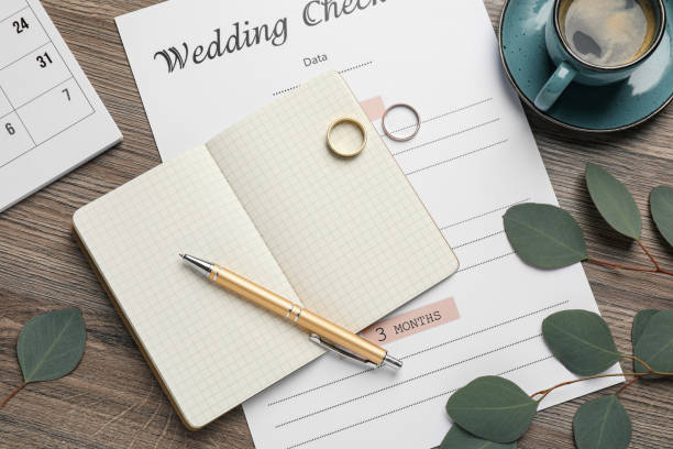 istock Flat lay composition with Wedding Checklist and planner on wooden table 1433812140