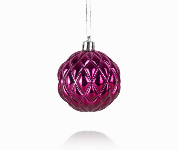 istock purple christmas ball with embossed pattern isolated on a white 1433815108