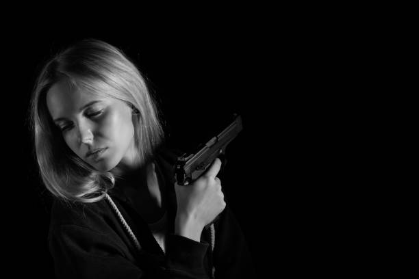 istock girl with gun 1433816545