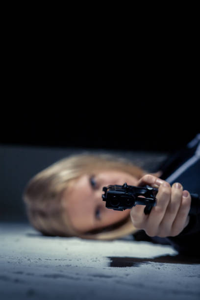 istock girl with gun 1433818500
