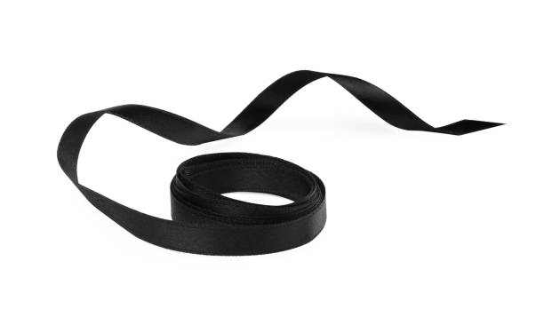 istock Beautiful rolled black ribbon isolated on white 1433820606