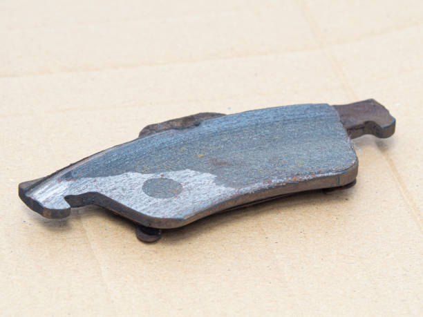 istock Used damaged brake pads need to change, close up. 1433820814