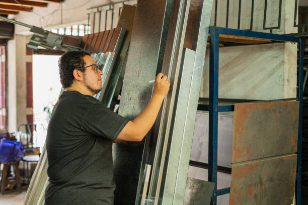 istock Employe of a locksmith are working on cutting material 1433828030