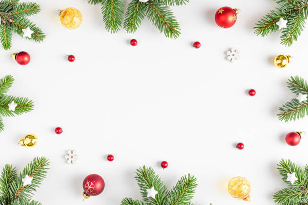 istock Christmas composition. Frame made of fir tree, festive decorations, red berries on white background. Flat lay 1433828604