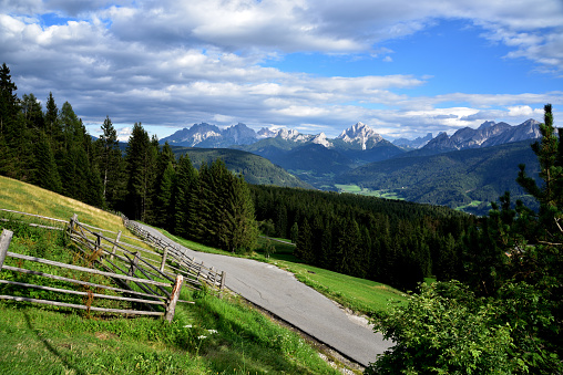 Large peaks characteristic of the Val Pusteria are the backdrop to the large woods that overlook the town of Tesido