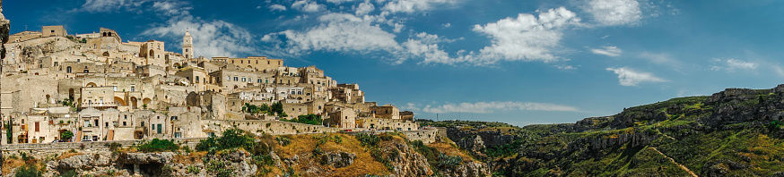 Matera (Basilicata, Italy) is located on a canyon, which defines Matera’s landscape and architecture. Inhabited since the Paleolithic era, established by the Romans in the 3rd century BC, the town is famous for its cave dwellings. The Sassi di Matera is the ancient town of houses carved into the rock. People lived here until the 1950s, but then they were moved because the place needed restoration. Today pubs, restaurants and hotels are found in this location.